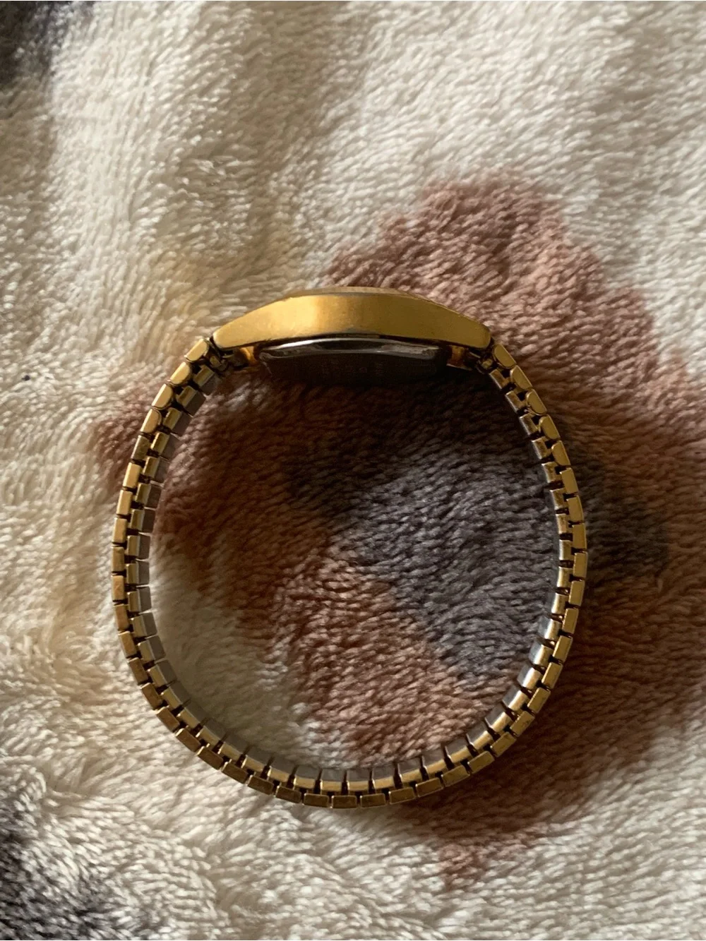 Armitron gold tone with black dial womens watch on stretch bracelet